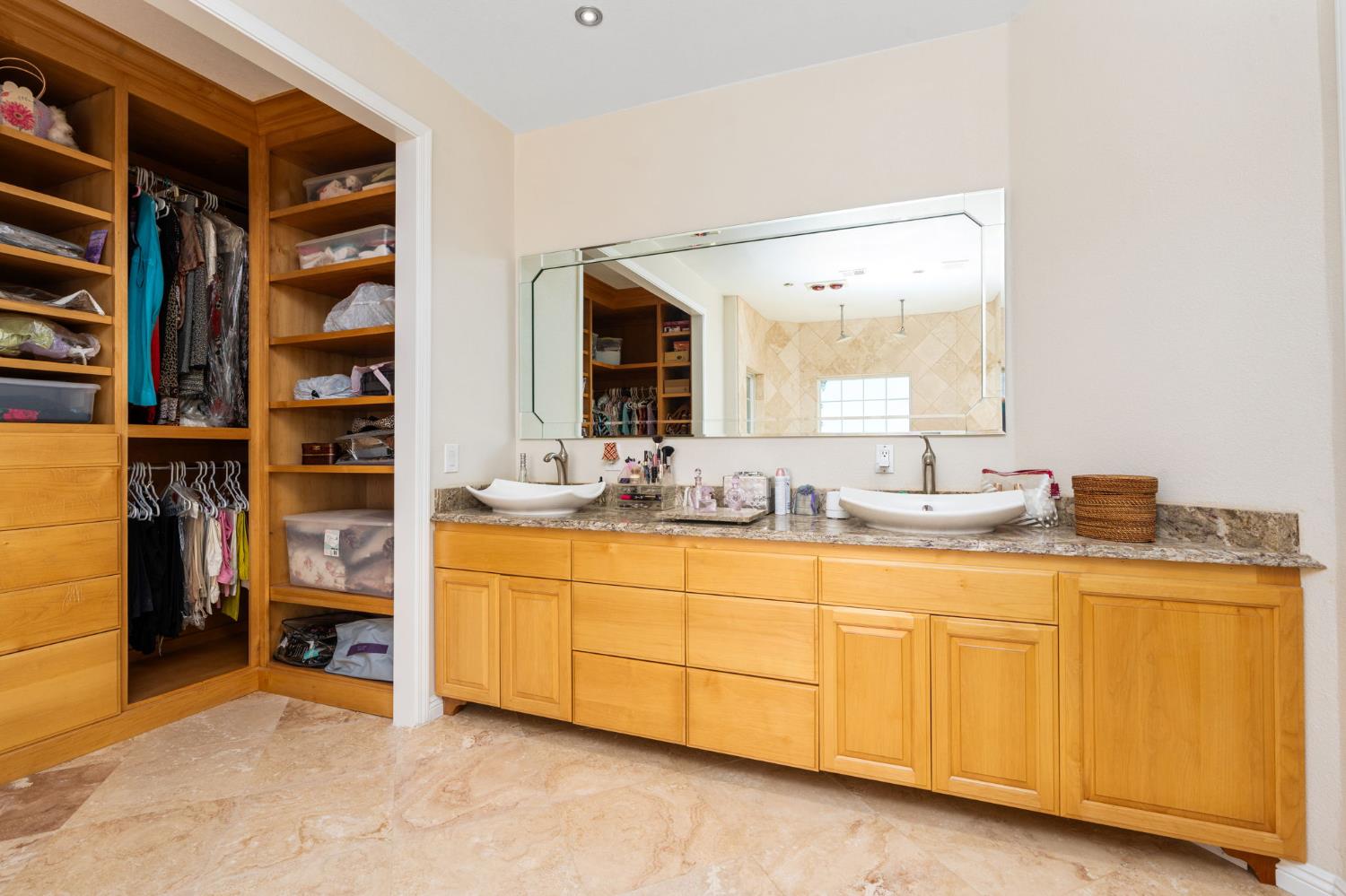 28565 Ave 21 Madera, CA 93638 - Photo 30 of 46 a spacious bathroom with a double vanity sink and a mirror