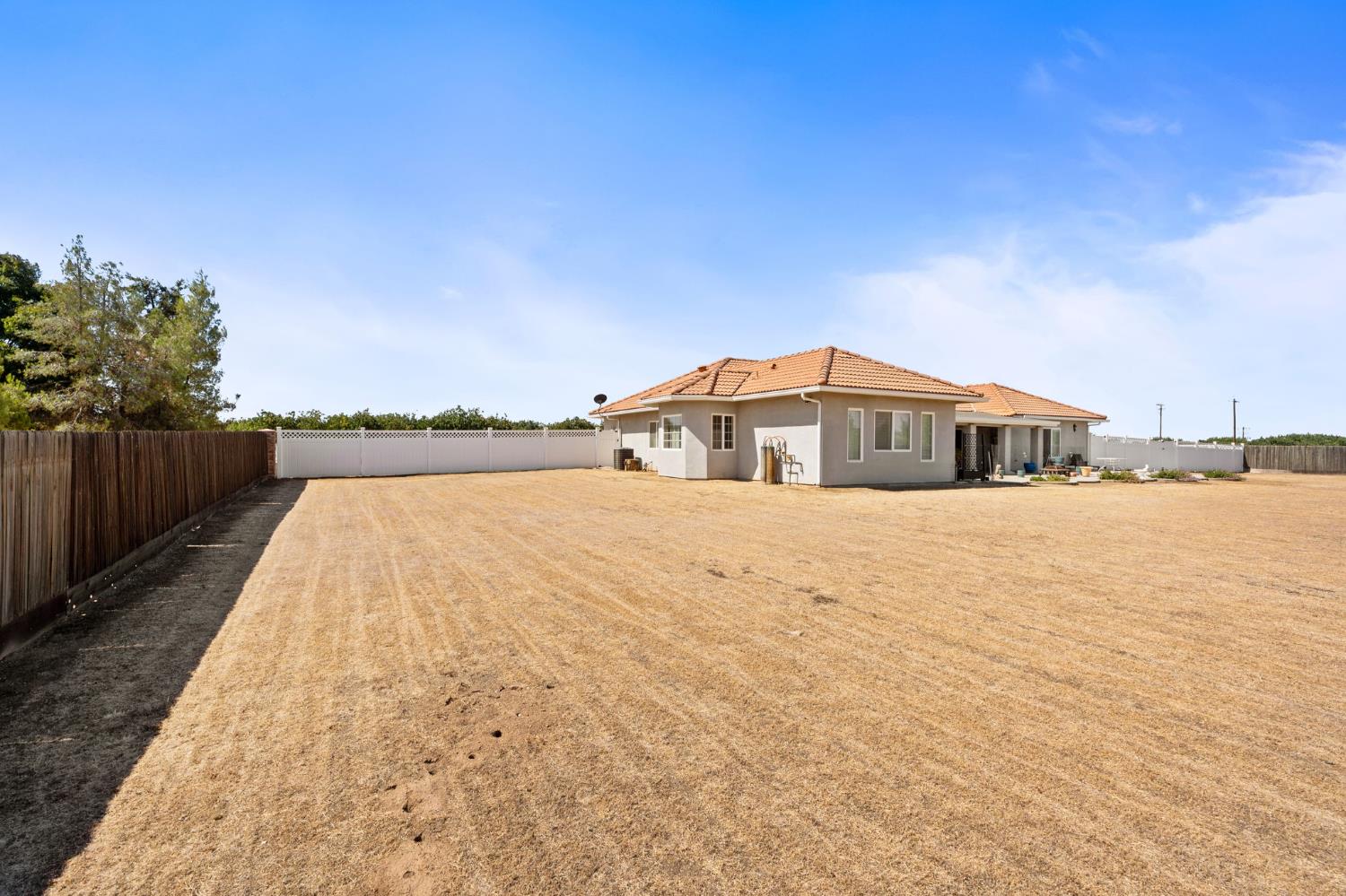 28565 Ave 21 Madera, CA 93638 - Photo 36 of 46 a house view with a lake view