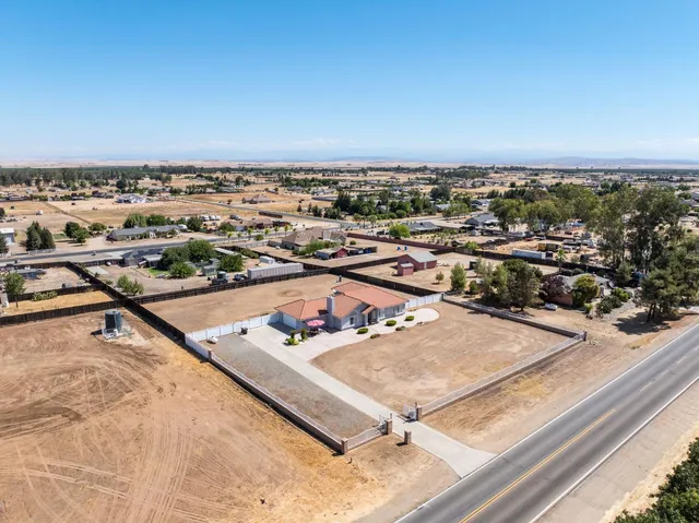 an aerial view of residential house with outdoor space