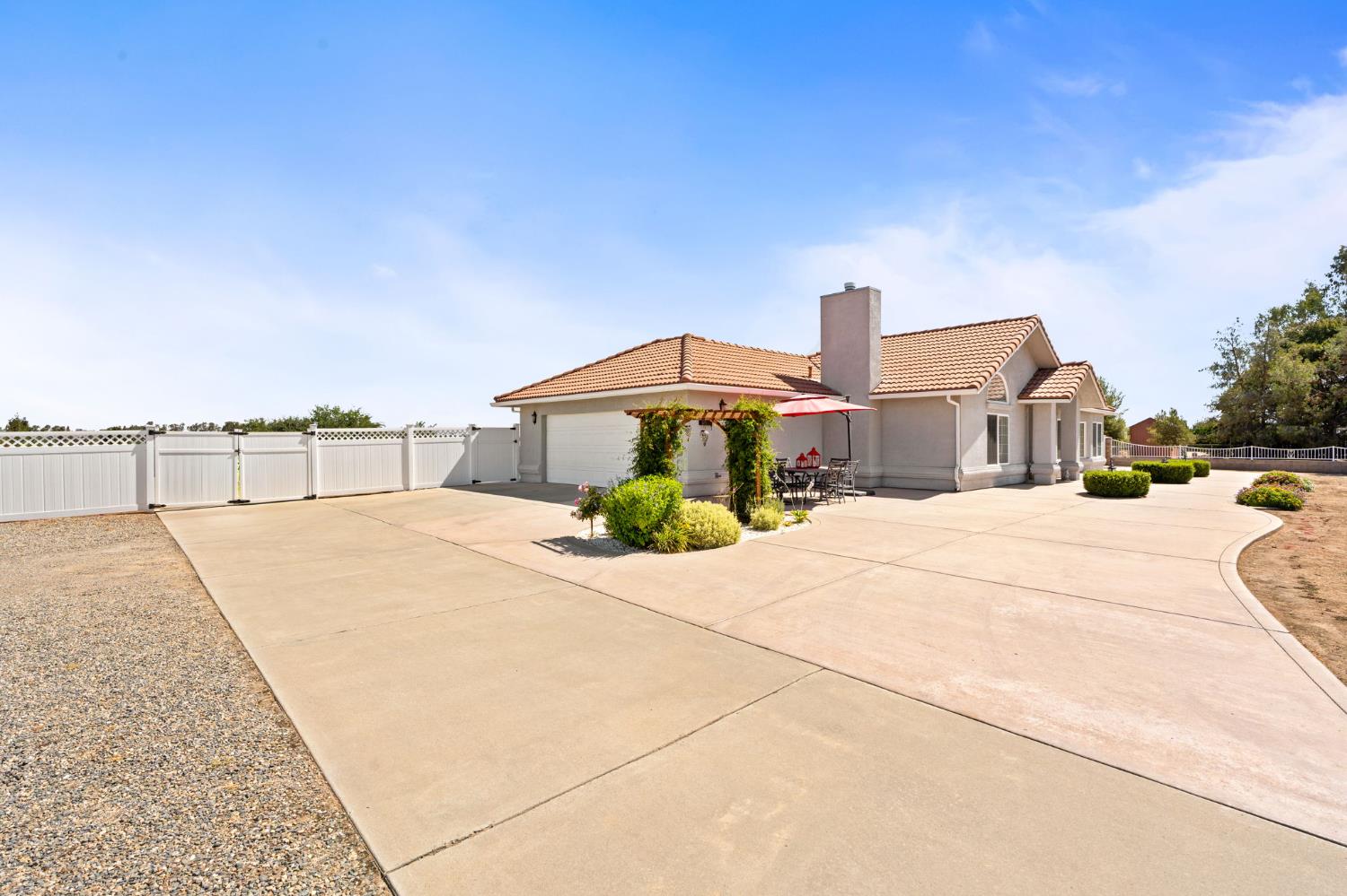 28565 Ave 21 Madera, CA 93638 - Photo 6 of 46 a house view with a outdoor space