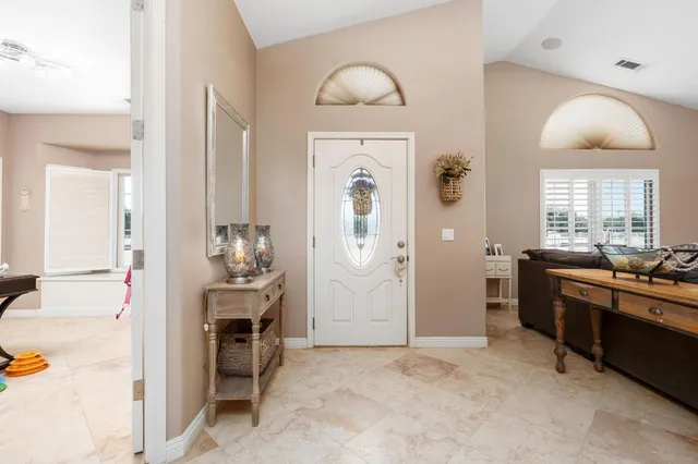 a view of a livingroom with furniture and windows
