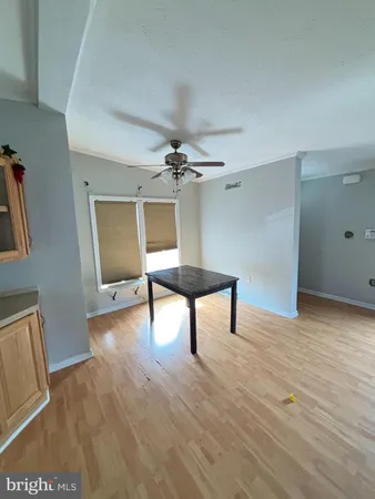 a view of a livingroom with furniture and wooden floor