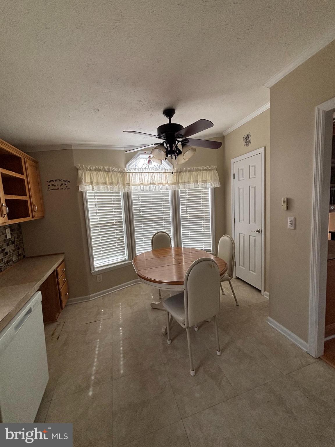 511 Sykesville Road, Unit 16 Wrightstown, NJ 08562 - Photo 4 of 12 a living room with furniture a window and a flat screen tv
