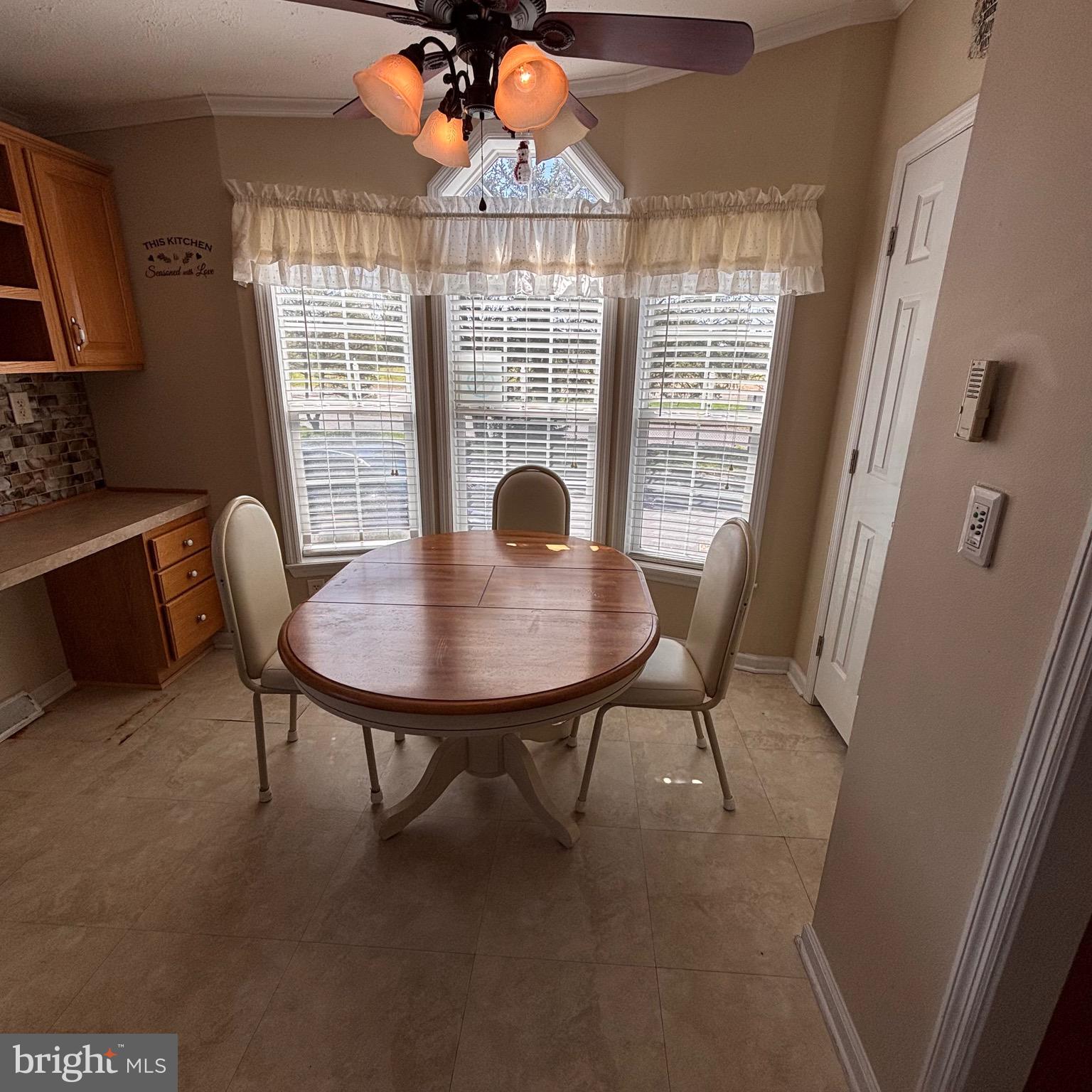 511 Sykesville Road, Unit 16 Wrightstown, NJ 08562 - Photo 5 of 10 a dining room with furniture and window
