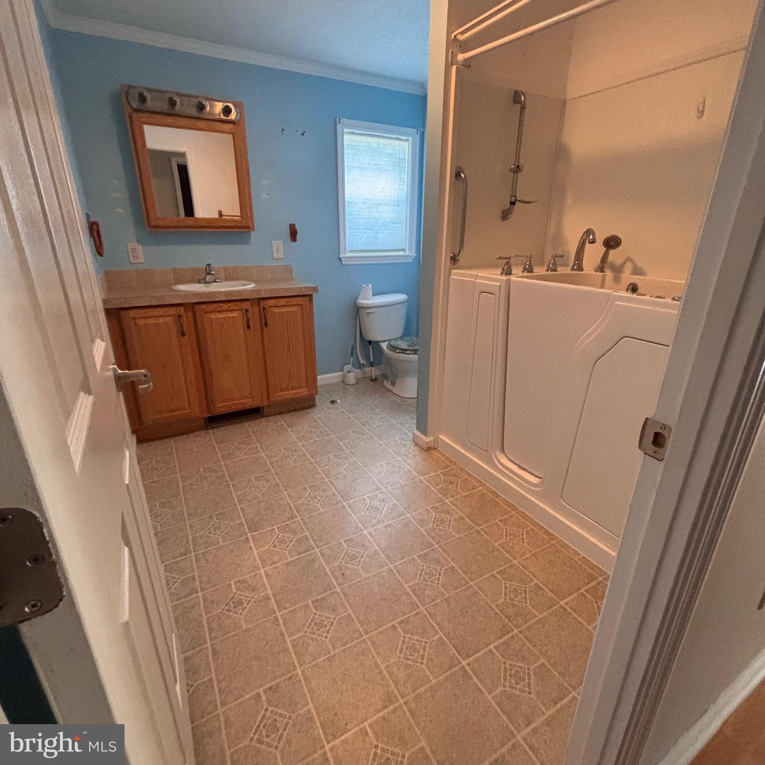 511 Sykesville Road, Unit 16 Wrightstown, NJ 08562 - Photo 8 of 10 a bathroom with a sink a toilet and a tub