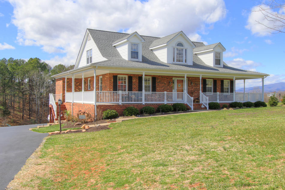 208 Longhill Road Goode, VA 24556 - Photo 1 of 59 a front view of a house with garden