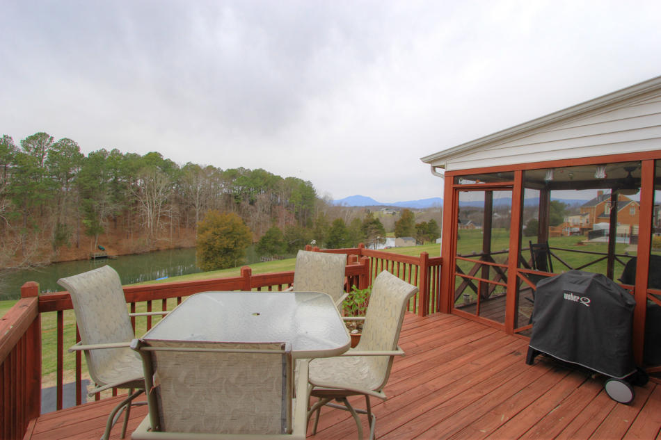 208 Longhill Road Goode, VA 24556 - Photo 15 of 59 an outdoor sitting area with furniture and wooden floor