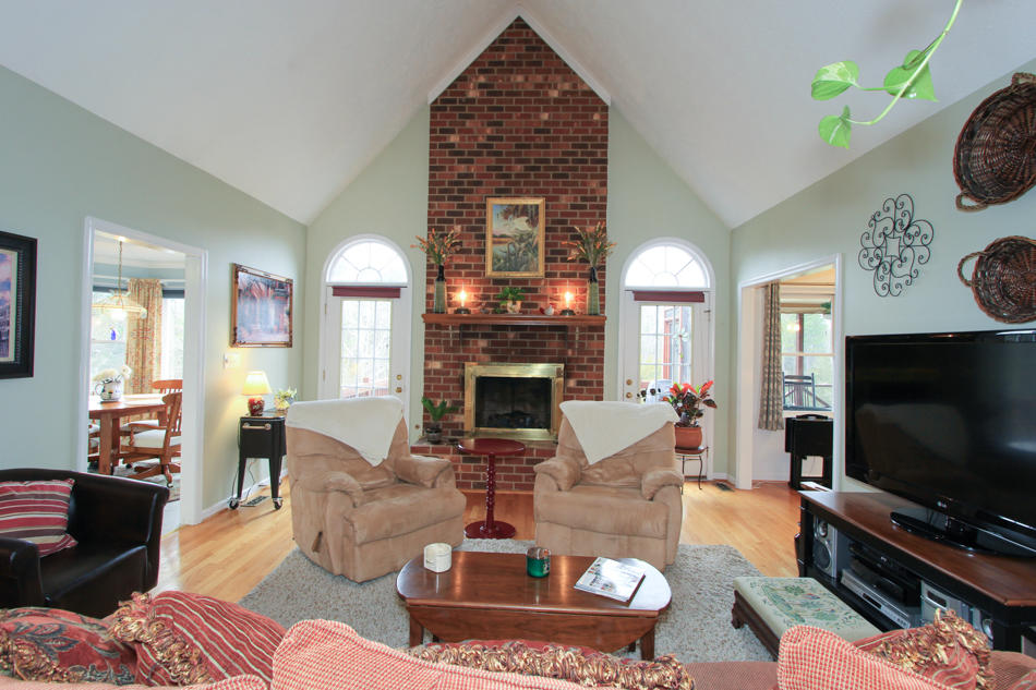 208 Longhill Road Goode, VA 24556 - Photo 3 of 59 a living room with furniture a fireplace and a flat screen tv