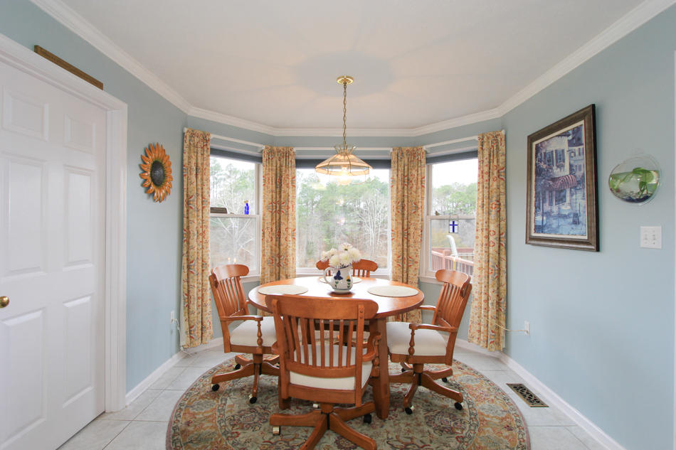 208 Longhill Road Goode, VA 24556 - Photo 25 of 59 a dining room with furniture a chandelier and window