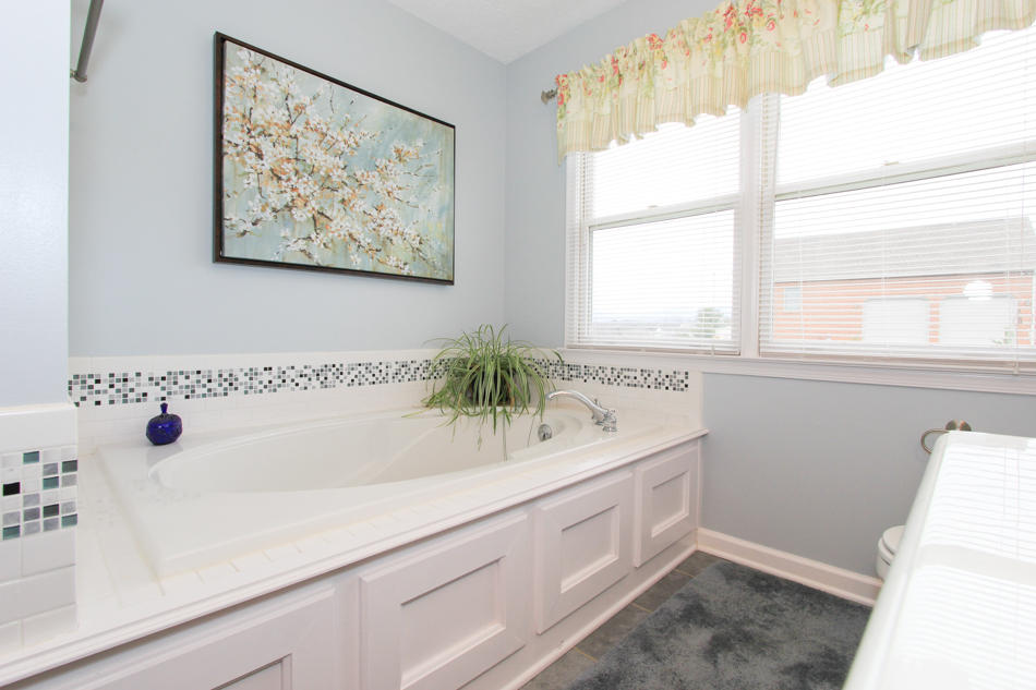 208 Longhill Road Goode, VA 24556 - Photo 34 of 59 a bathroom with a sink and a bathtub