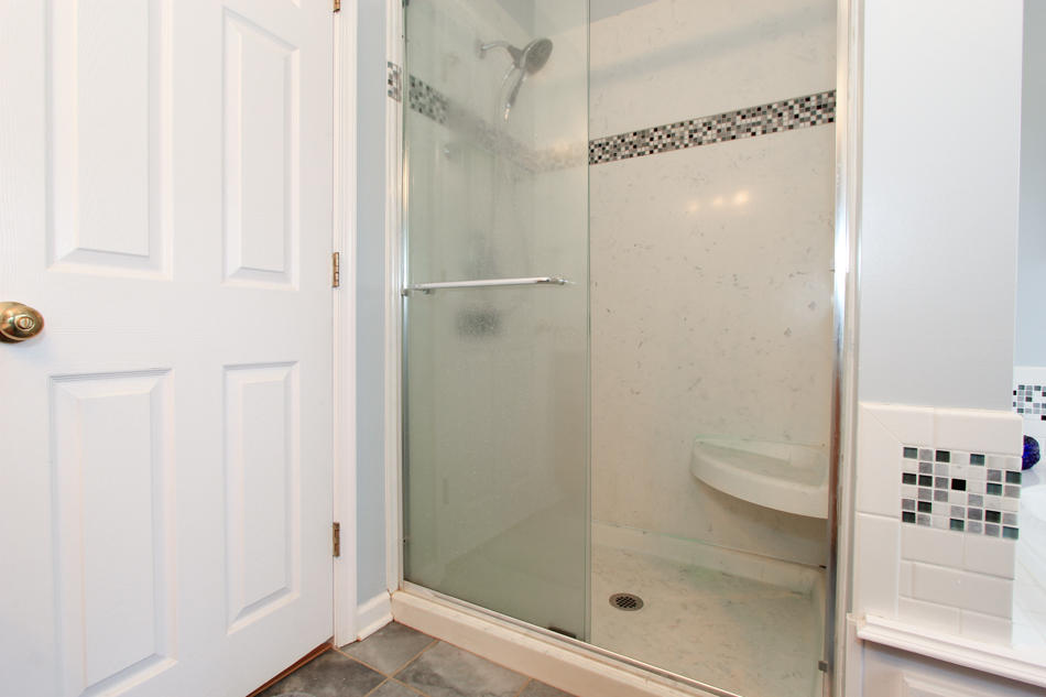 208 Longhill Road Goode, VA 24556 - Photo 35 of 59 a bathroom with a glass shower door