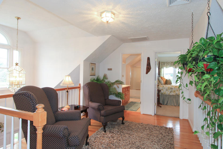 208 Longhill Road Goode, VA 24556 - Photo 39 of 59 a living room with furniture and a potted plant