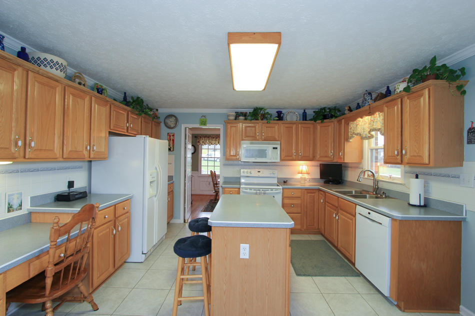 208 Longhill Road Goode, VA 24556 - Photo 5 of 59 a kitchen with stainless steel appliances granite countertop a sink stove and refrigerator