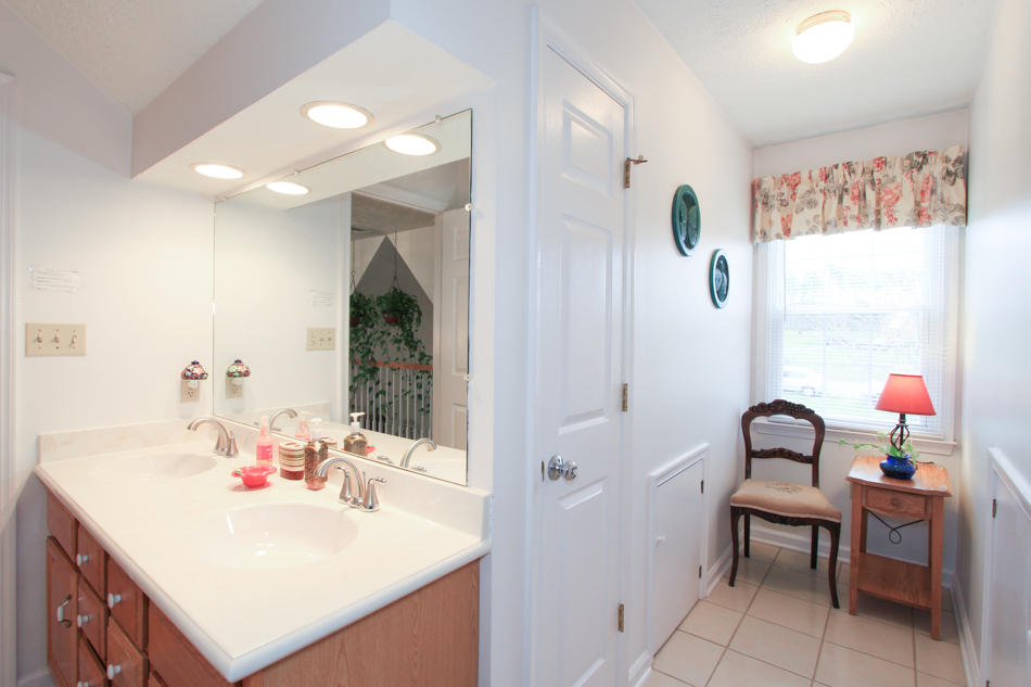 208 Longhill Road Goode, VA 24556 - Photo 43 of 59 a bathroom with a sink vanity and a mirror