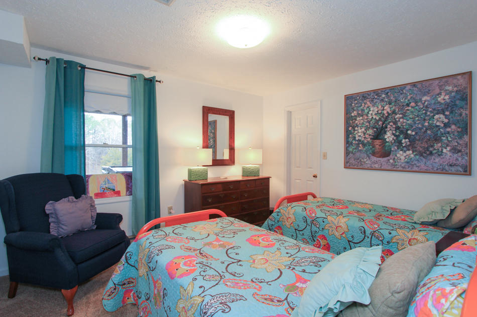 208 Longhill Road Goode, VA 24556 - Photo 55 of 59 a bedroom that has a bed and a dresser in it