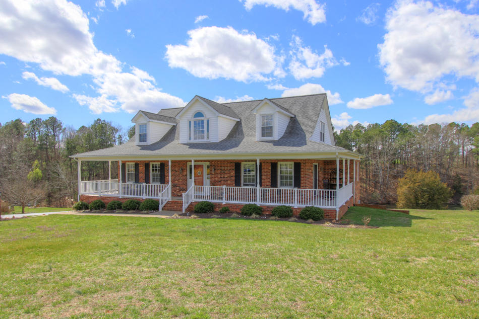208 Longhill Road Goode, VA 24556 - Photo 57 of 59 a view of a house with a garden and yard