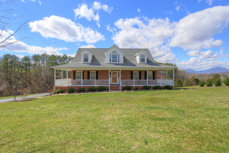 208 Longhill Road Goode, VA 24556 - Photo 59 of 59 a front view of a house with a garden