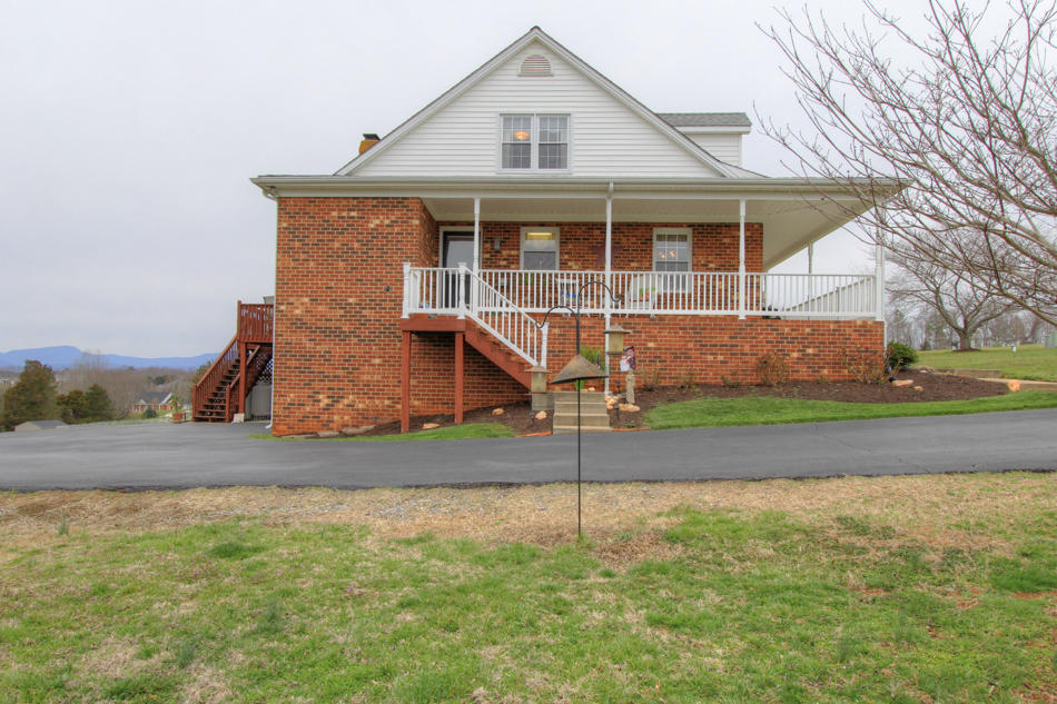 208 Longhill Road Goode, VA 24556 - Photo 10 of 59 a front view of a house with a yard
