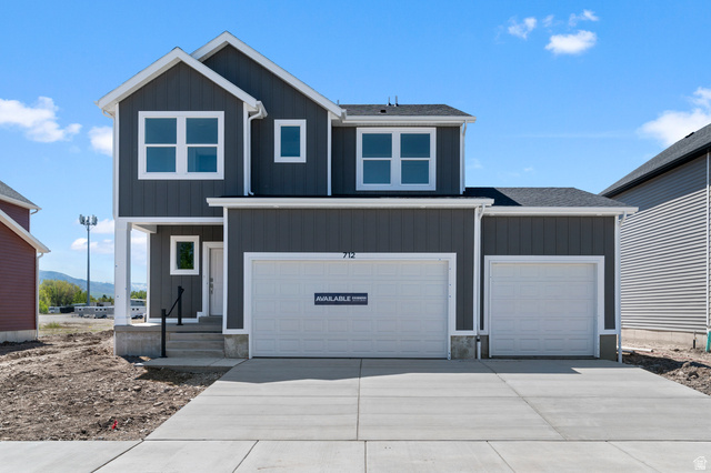 2829 North 710 West, Unit 15 Logan, UT 84321 - Photo 1 of 23 Modern two-story residence featuring dark gray vertical siding and white trim