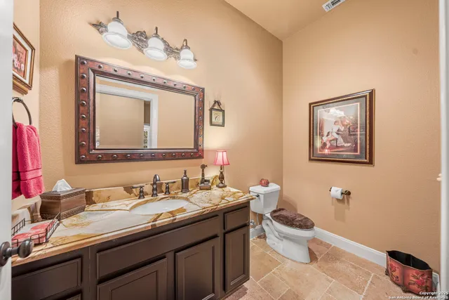 a spacious bedroom with a bed a table and a window