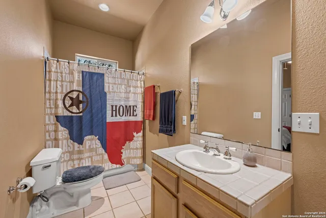 a spacious bedroom with a bed and large windows