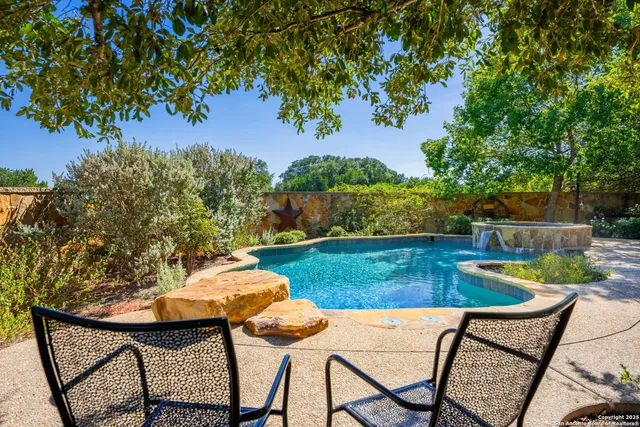 a wooden bench sitting in the middle of a park