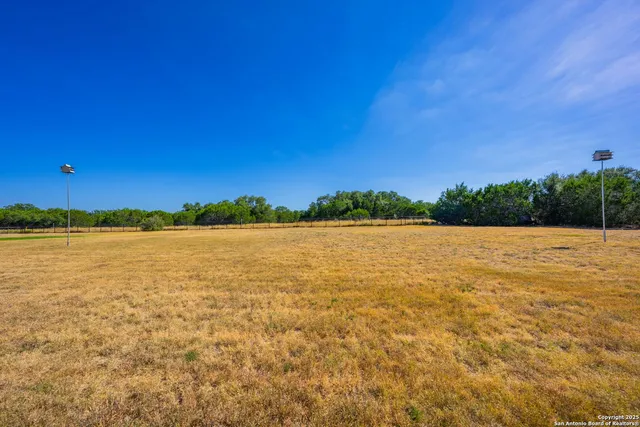 a view of swimming pool with a yard