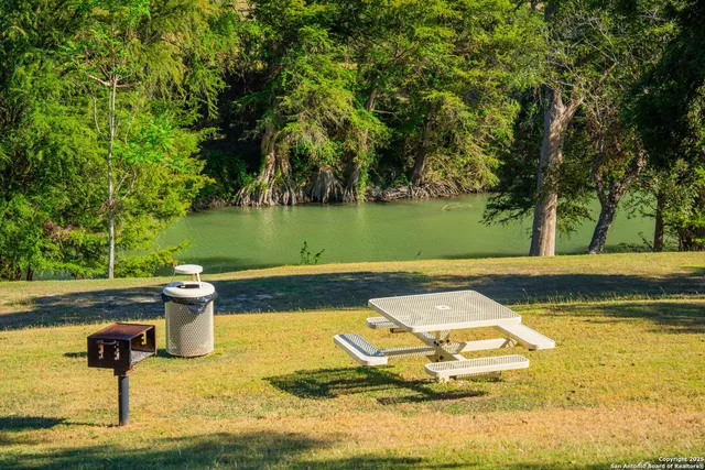 a view of a lake with a yard