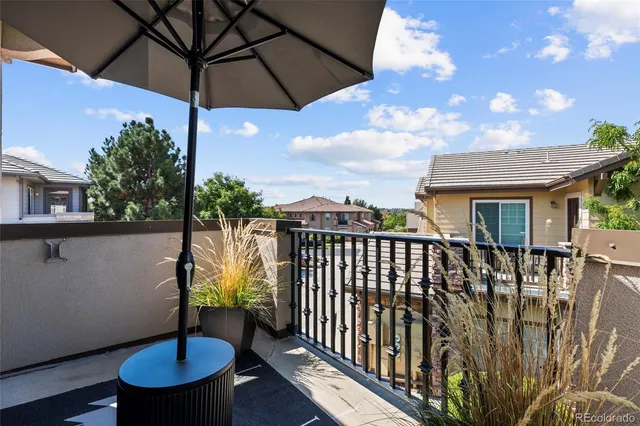 a view of a balcony with furniture