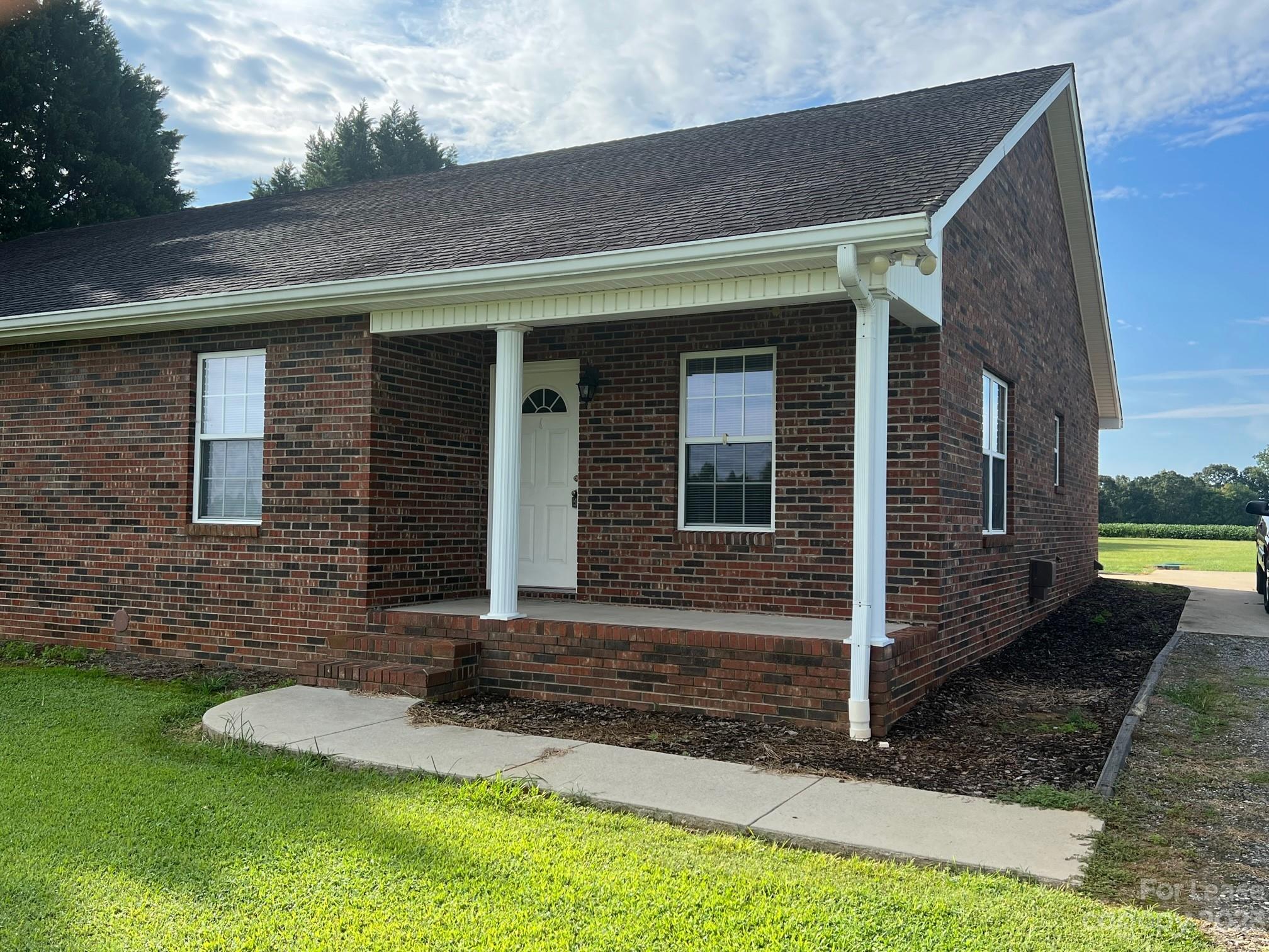 110 Rowan Road, Unit B Cleveland, NC 27013 - Photo 2 of 15 a front view of a house with a yard