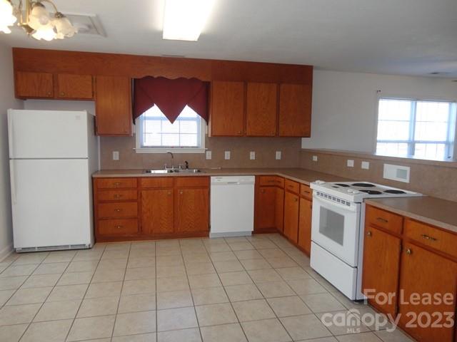 110 Rowan Road, Unit B Cleveland, NC 27013 - Photo 5 of 15 a kitchen with a stove sink and cabinets