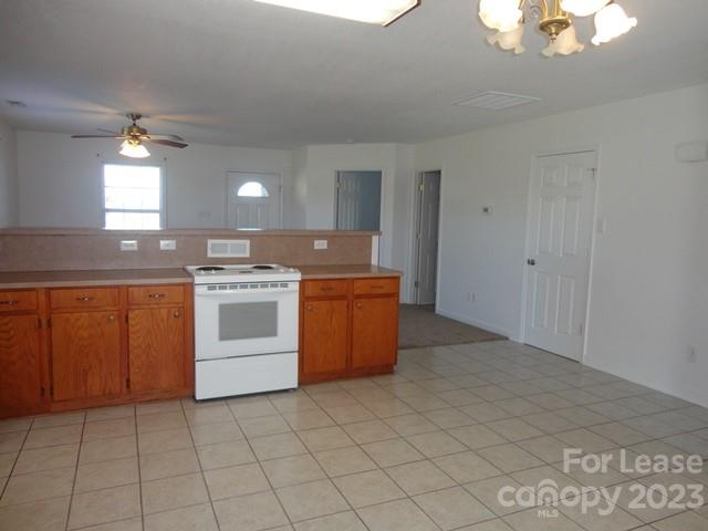 110 Rowan Road, Unit B Cleveland, NC 27013 - Photo 6 of 15 a kitchen with a stove top oven and cabinets
