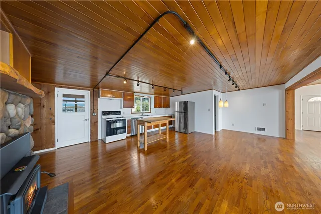 a view of a livingroom with wooden floor