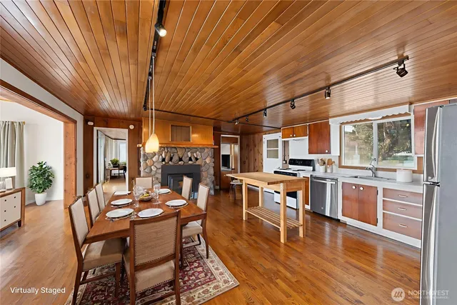 a view of a dining room with furniture window and wooden floor