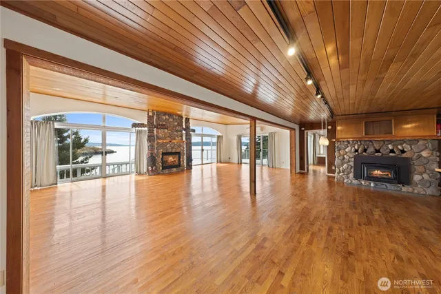 a view of an entryway with wooden floor