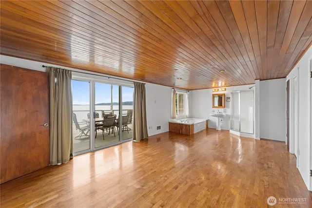 a view of a livingroom with furniture and a window
