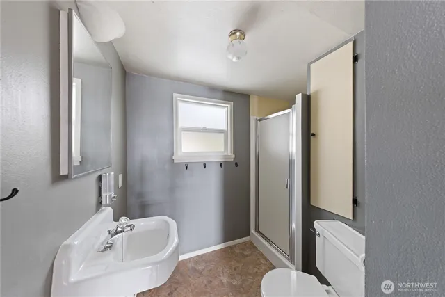 a view of a patio with table and chairs with wooden floor and fence