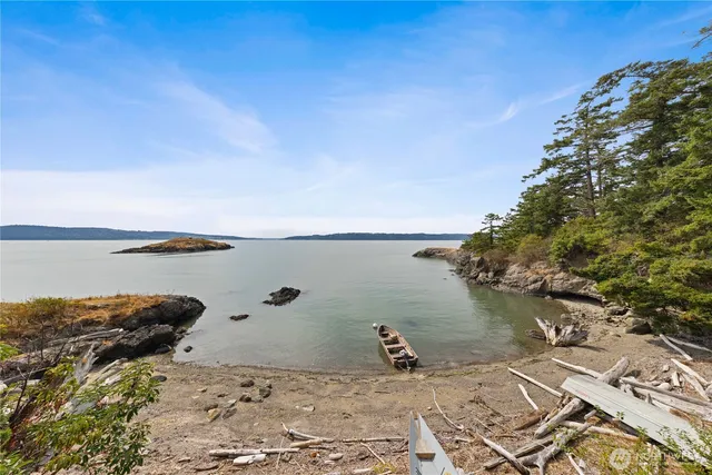 a view of a lake next to a building with an outdoor space