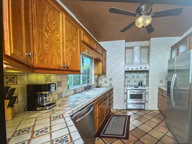 a bedroom with furniture and a chandelier