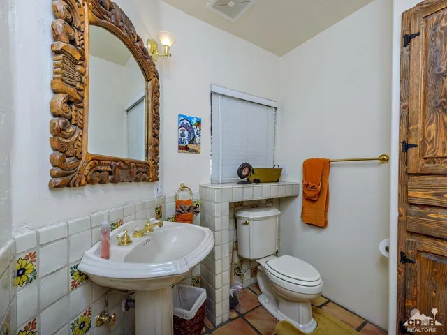 a view of a backyard with wooden fence