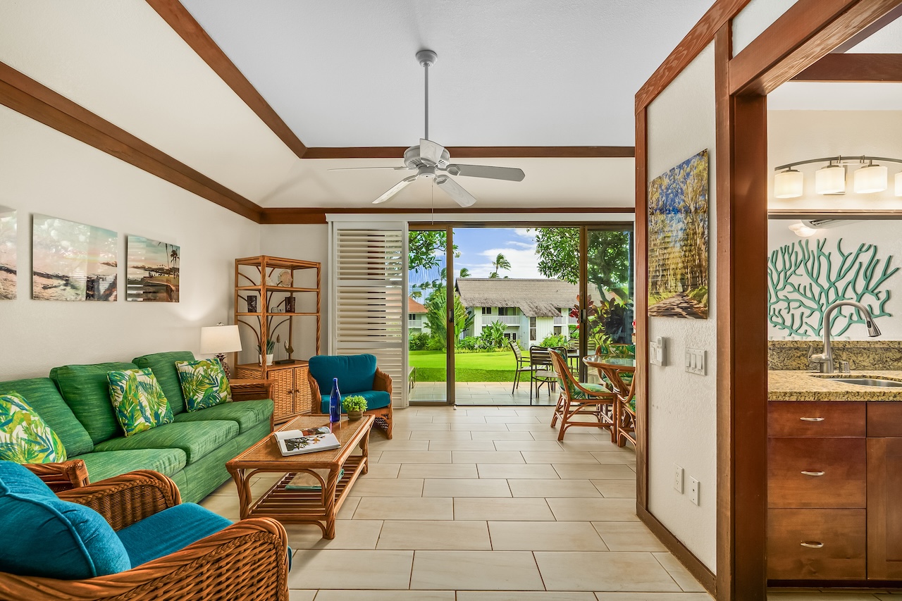 2253 Poipu Road, Unit 115 Koloa, HI 96756 - Photo 12 of 24 a living room with furniture and a floor to ceiling window