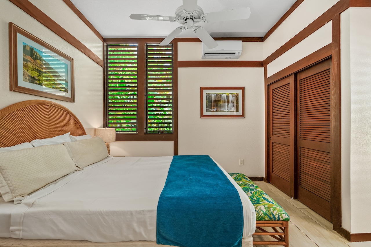 2253 Poipu Road, Unit 115 Koloa, HI 96756 - Photo 13 of 24 a bedroom with a bed and a window