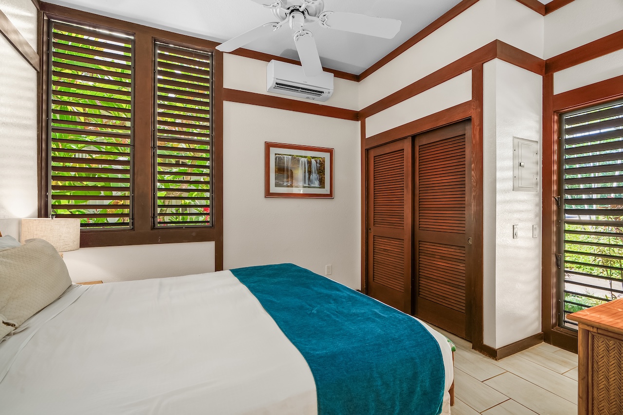 2253 Poipu Road, Unit 115 Koloa, HI 96756 - Photo 15 of 24 a bedroom with a bed and a window