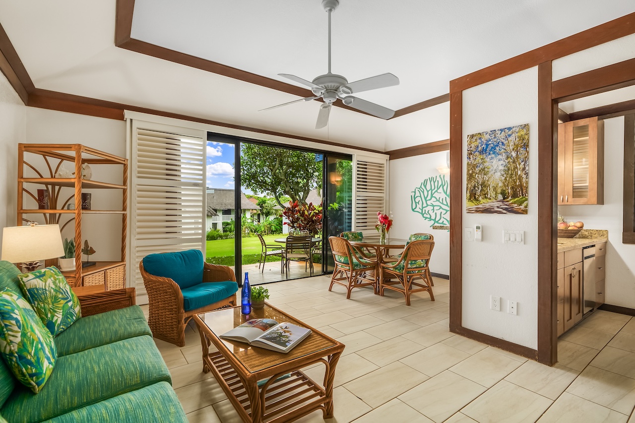 2253 Poipu Road, Unit 115 Koloa, HI 96756 - Photo 3 of 24 a living room with furniture and a floor to ceiling window