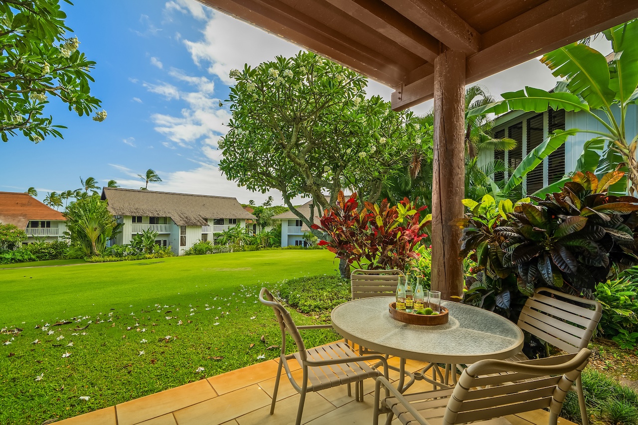 2253 Poipu Road, Unit 115 Koloa, HI 96756 - Photo 5 of 24 a table and chairs in front of a house