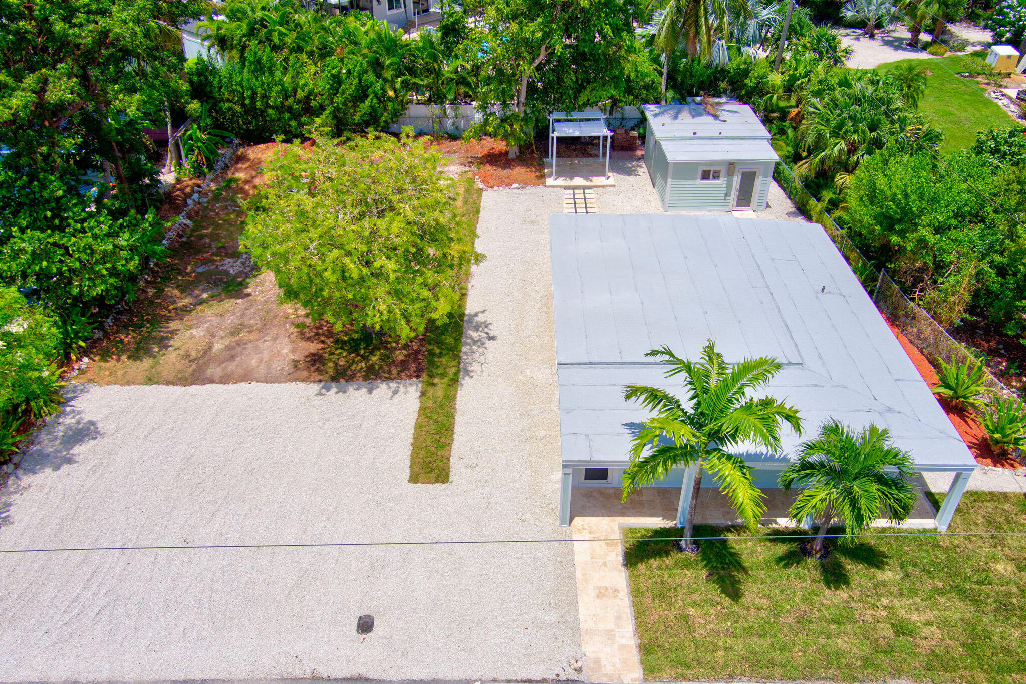 an aerial view of a house with outdoor space