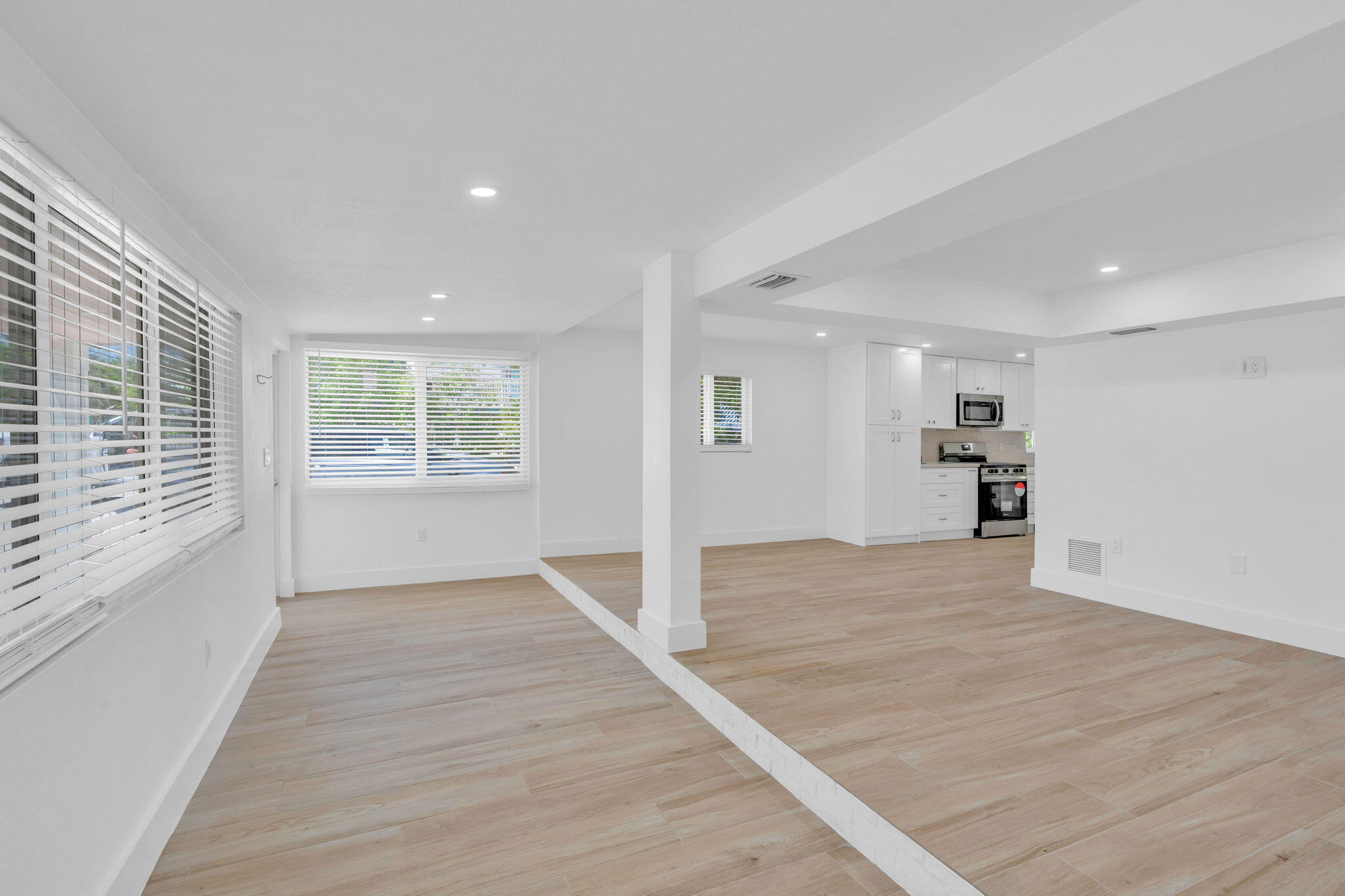 15 Seaside Avenue Key Largo, FL 33037 - Photo 11 of 39 an empty room with wooden floor and windows