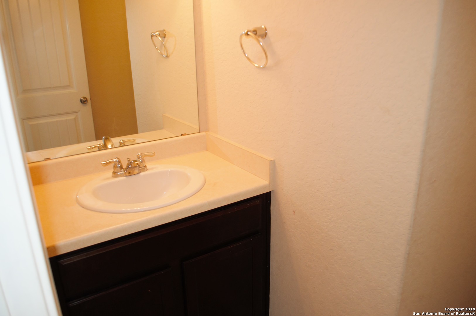 1623 Tree San Antonio, TX 78245 - Photo 11 of 21 a bathroom with a sink and a mirror