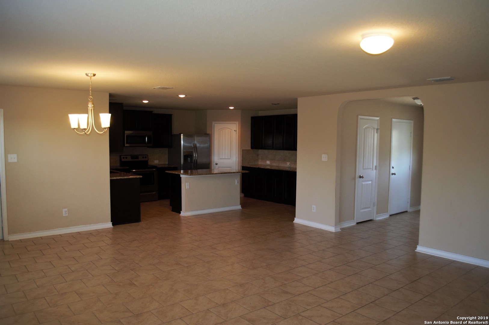 1623 Tree San Antonio, TX 78245 - Photo 4 of 21 a view of kitchen with kitchen island and stainless steel appliances