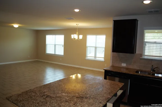 a view of a kitchen and dining room